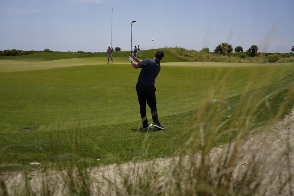 Jon Rahm, of Spain, chips to the green on the sixth hole during a practice round at the PGA Championship golf tournament on the Ocean Course Tuesday, May 18, 2021, in Kiawah Island, S.C. (AP Photo/David J. Phillip)