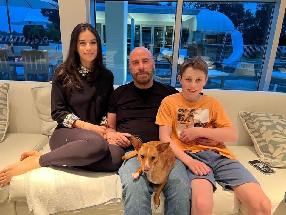 John Travolta with his children Ella and Ben - with their pool in the background