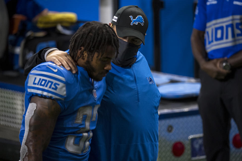 Detroit Lions RB D'Andre Swift is comforted by head coach Matt Patricia while walking off the field after the game against the Chicago Bears. (Photo by Nic Antaya/Getty Images)