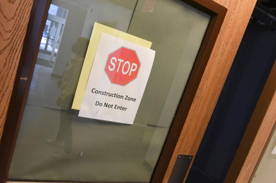 Signs for a construction zone sit outside the doors to current construction on the Katherine Johnson Education Center Thursday, Jan. 27, 2022, in St. Cloud.