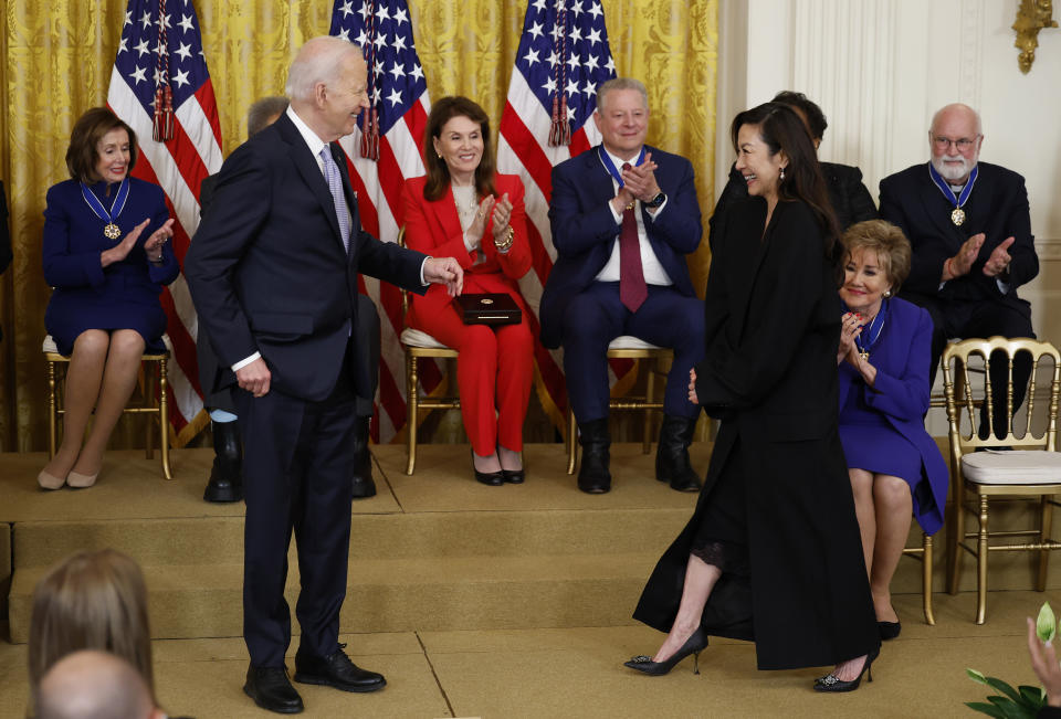 WASHINGTON, DC - MAY 03: U.S. President Joe Biden awards the Medal of Freedom to Actress Michelle Yeoh during a ceremony in the East Room of the White House on May 3, 2024 in Washington, DC. President Biden awarded the Presidential Medal of Freedom, the Nation’s highest civilian honor, to 19 individuals including political leaders, civil rights icons and other influential cultural icons. (Photo by Kevin Dietsch/Getty Images)