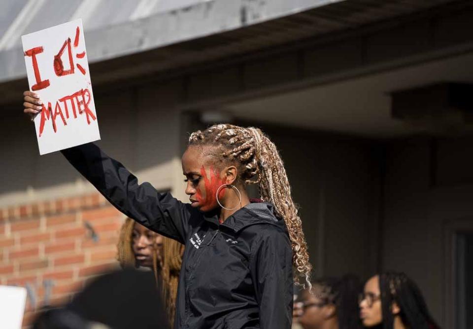 Delaware State University freshman Naomi Rivers of Ellendale attends a protest wearing red paint on her face because she said it's symbolic of the helplessness she feels on the university's campus, in the wake of multiple allegations of sexual assault on campus this school year on Wednesday, Jan. 18, 2023.