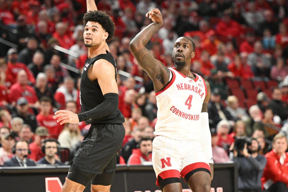 Juwan Gary of the Nebraska Cornhuskers scores on a three-point shot against Malik Hall of the Michigan State Spartans in the first half at Pinnacle Bank Arena on Dec. 10, 2023, in Lincoln, Nebraska.