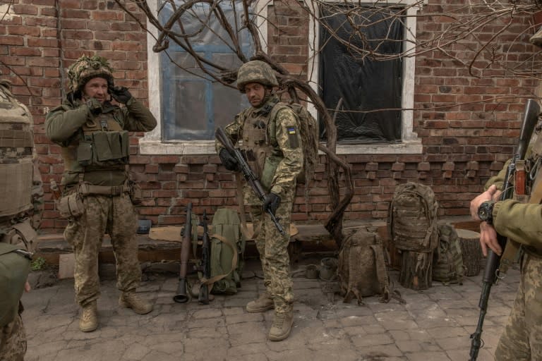 Ukrainian soldiers from the 23rd Mechanized Brigade prepare to head toward the frontline in the Donetsk region on April 3, 2024 (Roman PILIPEY)