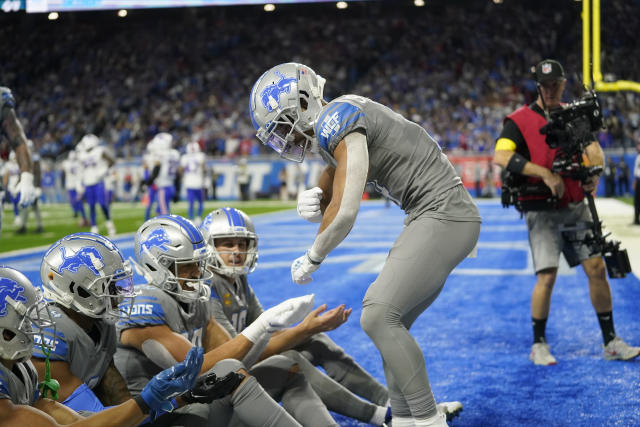 Detroit Lions wide receiver Amon-Ra St. Brown reacts after his 1-yard  reception for a touchdown during the first half of an NFL football game  against the Buffalo Bills, Thursday, Nov. 24, 2022