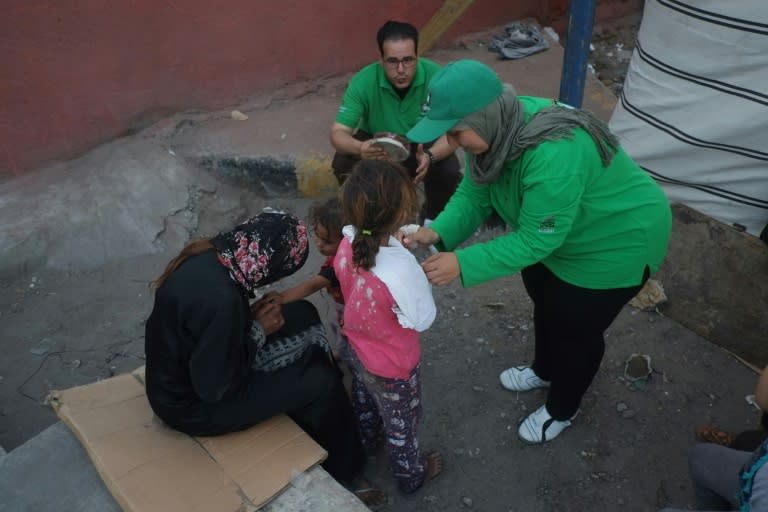 Government workers train homeless children in first aid and try to gather paperwork so that they can be moved to a shelter