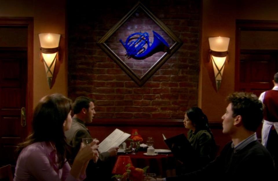 Robin and Ted in HIMYM admire a blue french horn on the wall