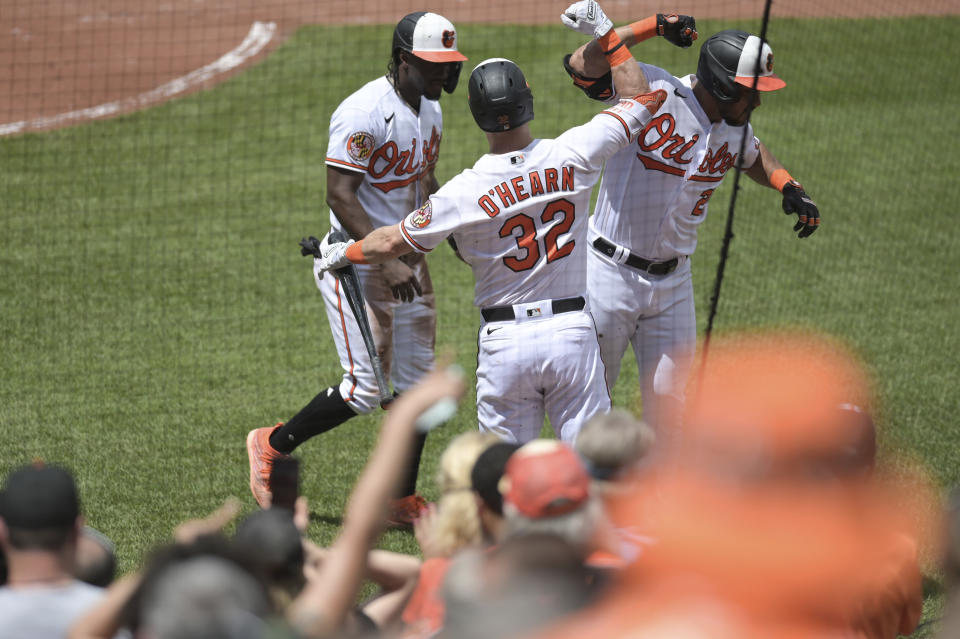 Baltimore Orioles' Anthony Santander, right, celebrates with Ryan O'Hearn (32) after hitting a two-run home run during the third inning of a baseball game against the Seattle Mariners, Sunday, June 25, 2023, in Baltimore. (AP Photo/Tommy Gilligan)