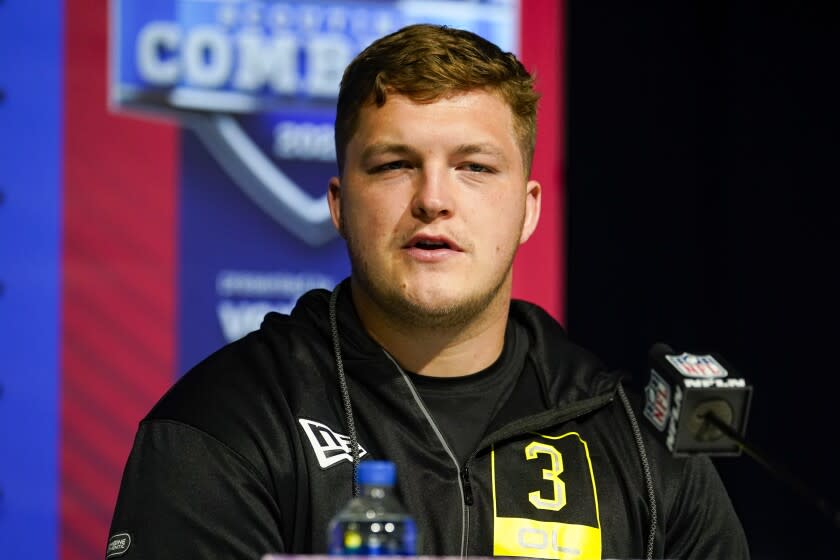 Wisconsin offensive lineman Logan Bruss speaks during a press conference at the NFL football scouting combine in Indianapolis, Thursday, March 3, 2022. (AP Photo/Michael Conroy)