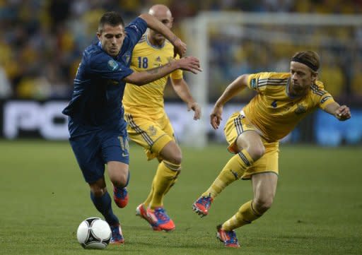 French midfielder Jeremy Menez (L) clashes with Ukrainian midfielder Anatoliy Tymoshchuk during their Euro 2012 championships football match at the Donbass Arena in Donetsk. France leapfrogged Euro 2012 co-hosts Ukraine in the Group D table here on Friday after beating them 2-0
