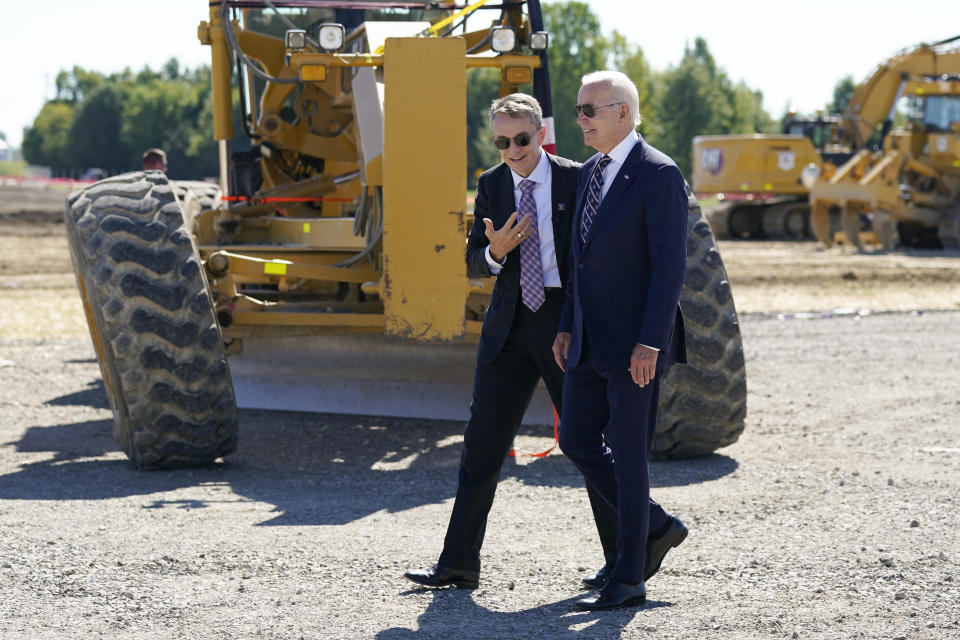 President Joe Biden speaks with Intel CEO Pat Gelsinger as he arrives at the groundbreaking of the new Intel semiconductor manufacturing facility in New Albany, Ohio, Friday, Sep. 9, 2022. (AP Photo/Manuel Balce Ceneta)