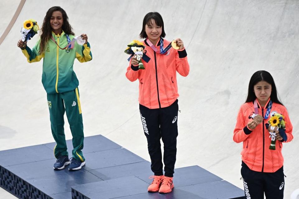 (Left to right) Brazil's Rayssa Leal (silver), Japan's Momiji Nishiya (gold) and Japan's Funa Nakayama (bronze) pose during the medal ceremony of the podium ceremony of the skateboarding women's street final of the Tokyo 2020 Olympic Games at Ariake Sports Park in Tokyo on July 26, 2021.<span class="copyright">Lionel Bonaventure—AFP/Getty Images</span>