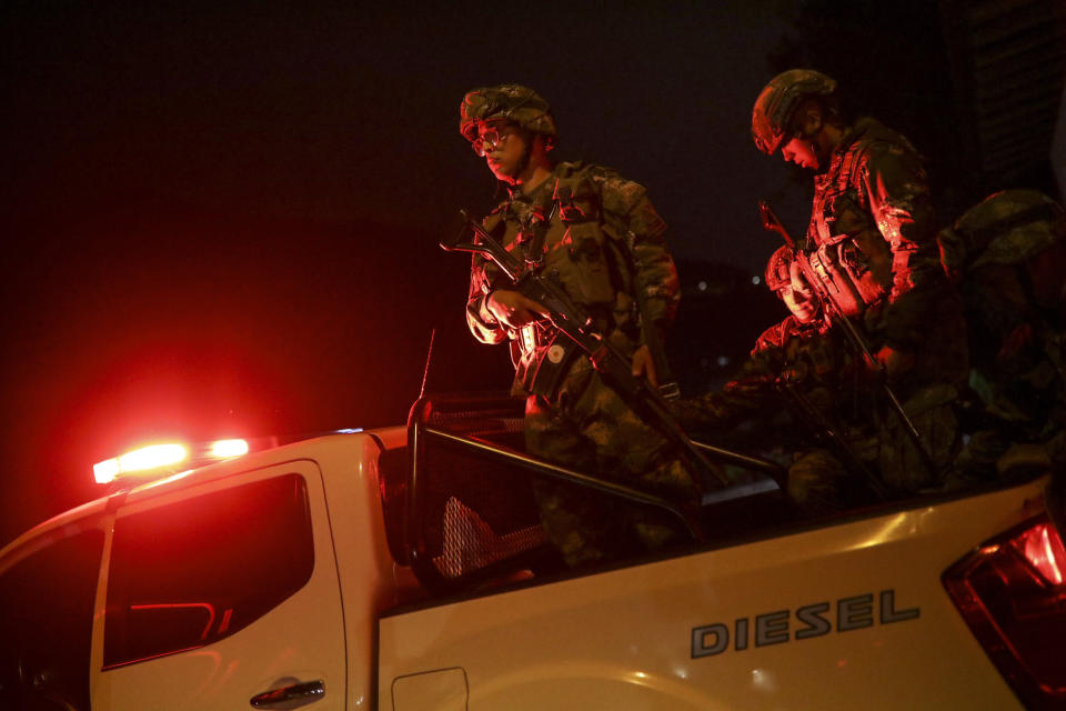 Soldiers leave from a military base to patrol the streets in Bogota, Colombia, Saturday, Nov. 23, 2019. Authorities in Colombia are maintaining a heightened police and military presence in the nation's capital following two days of unrest. (AP Photo/Ivan Valencia)