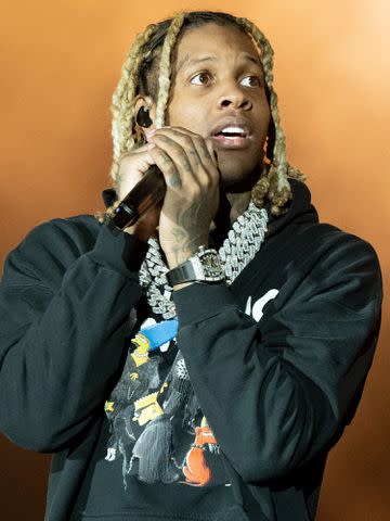 <p>Scott Dudelson/Getty</p> Lil Durk performs onstage during Day 1 of Rolling Loud Los Angeles on December 10, 2021.