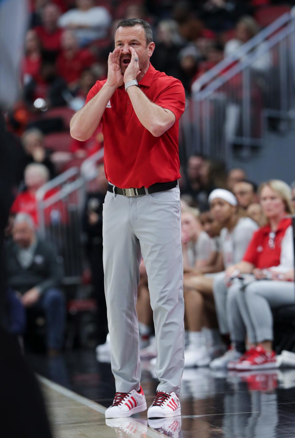 U of L head coach Jeff Walz instructed his team against NC State during their game at the Yum Center in Louisville, Ky. on Jan. 22, 2023.  