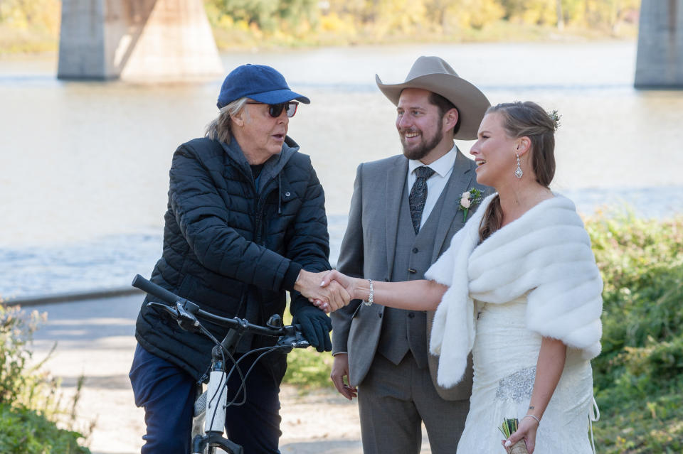 The Beatles legend rode past the pair on his bike. Photo: Supplied/madixphotography