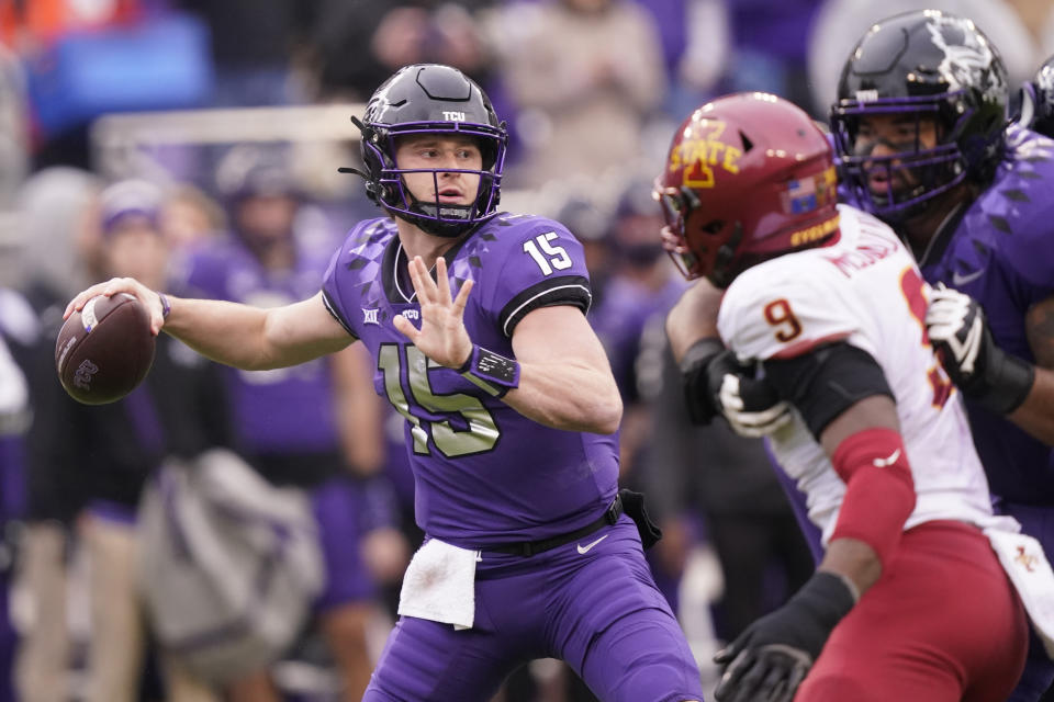 TCU quarterback Max Duggan (15) passes with blocking from teammate offensive tackle Andrew Coker against Iowa State defensive end Will McDonald IV (9) during the first quarter of an NCAA college football game in Fort Worth, Texas, Saturday, Nov. 26, 2022. (AP Photo/LM Otero)