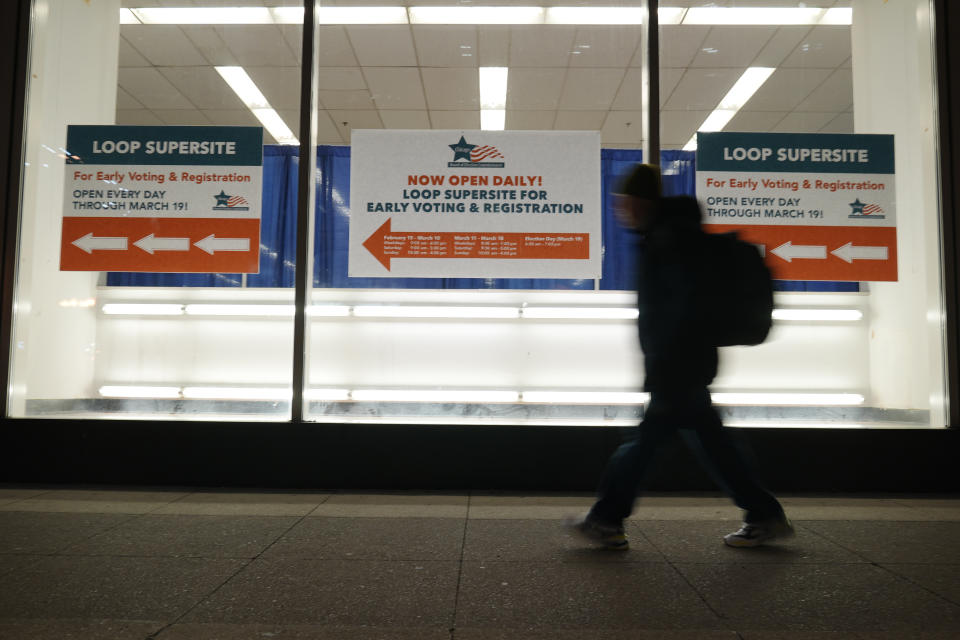 A voter walks to Chicago Loop Super Site in Chicago, Tuesday, March 19, 2024. Illinois residents will vote Tuesday to narrow Democratic and GOP candidate fields in key U.S. House races. (AP Photo/Nam Y. Huh)