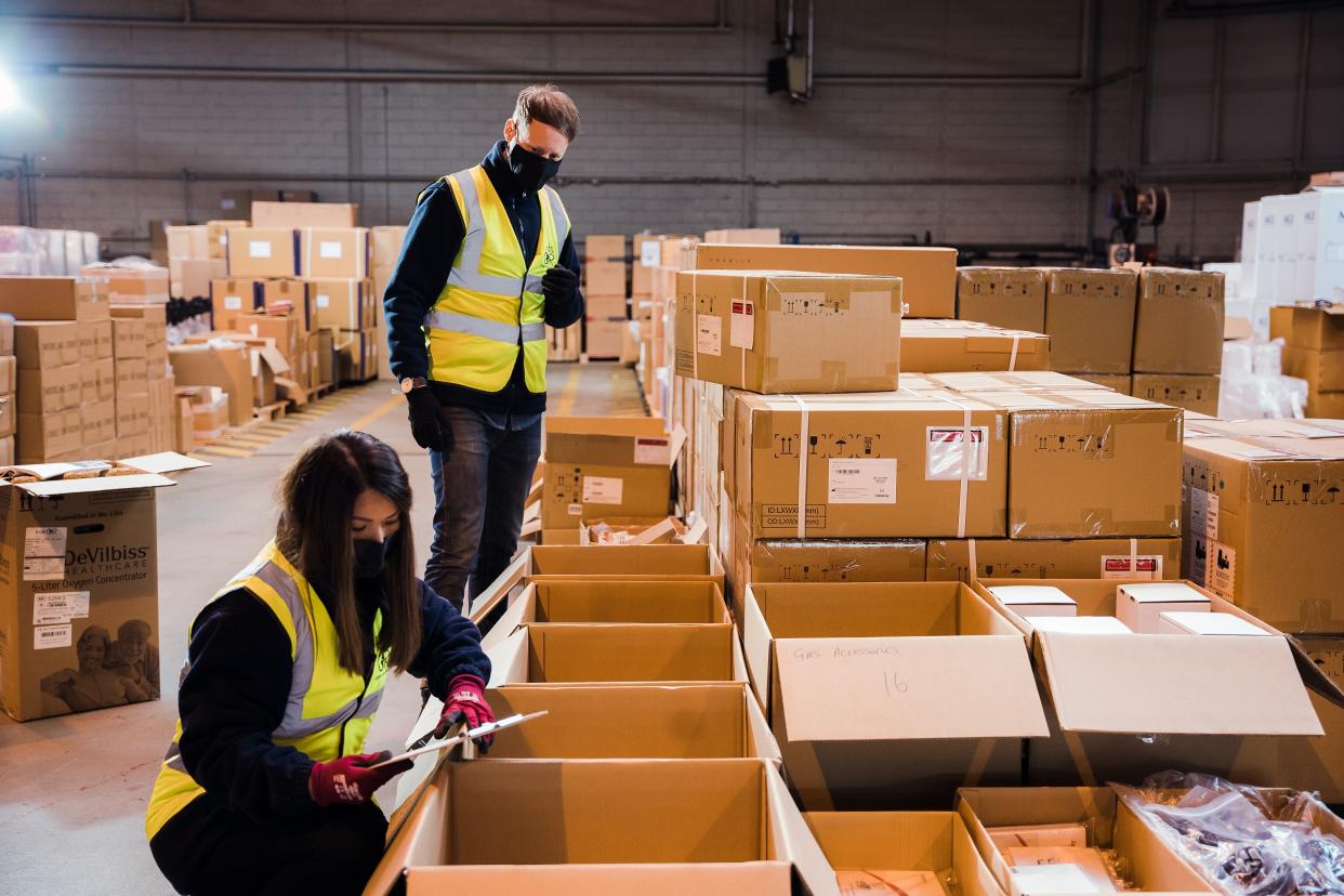 Staff at the Dundee depot prepare the equipment that will be shipped