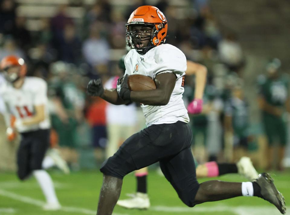 Middleboro's Bolu Sotonwu, scores a second quarter touchdown during a game versus Abington on Friday, October 27, 2023.