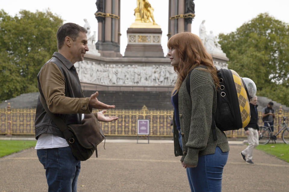 This image released by Apple shows Sam Rockwell, left, and Bryce Dallas Howard in a scene from "Argylle." (Peter Mountain/Apple via AP)