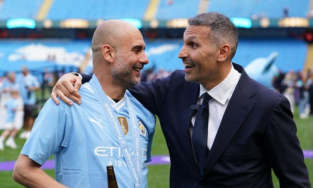 Pep Guardiola hugs chairman Khaldoon Al Mubarak 