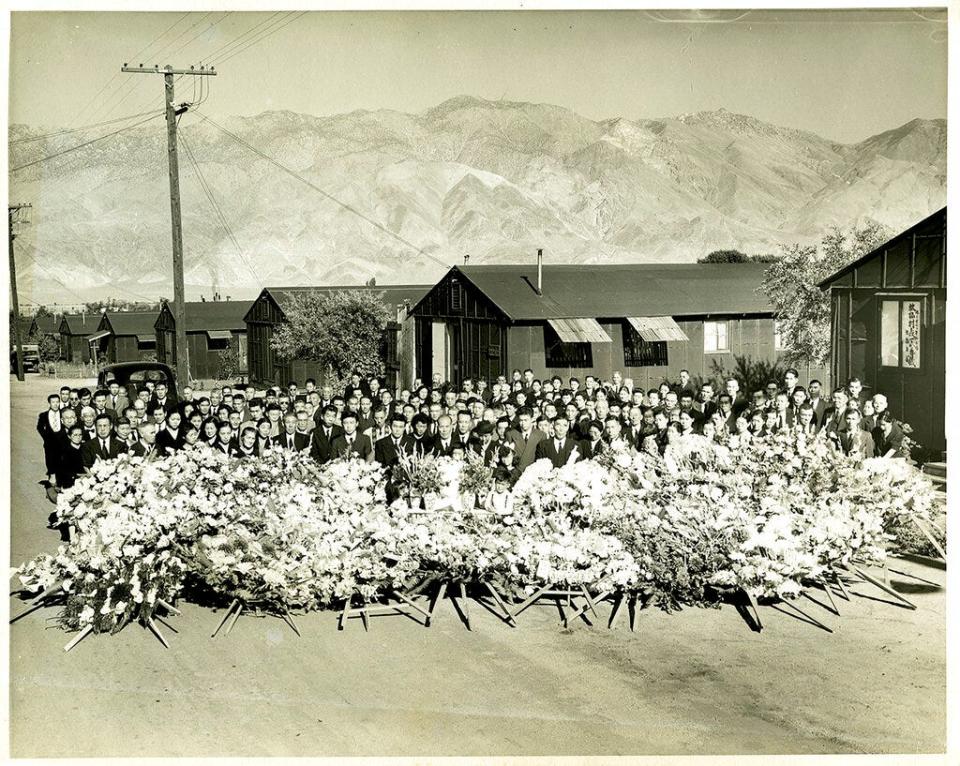 This 1945 photo provided by the Toyo Miyatake Studio shows a memorial service for Giichi Matsumura, who died on nearby Mount Williamson during his incarceration at an internment camp for people of Japanese ancestry in Manzanar, Calif., during World War II.