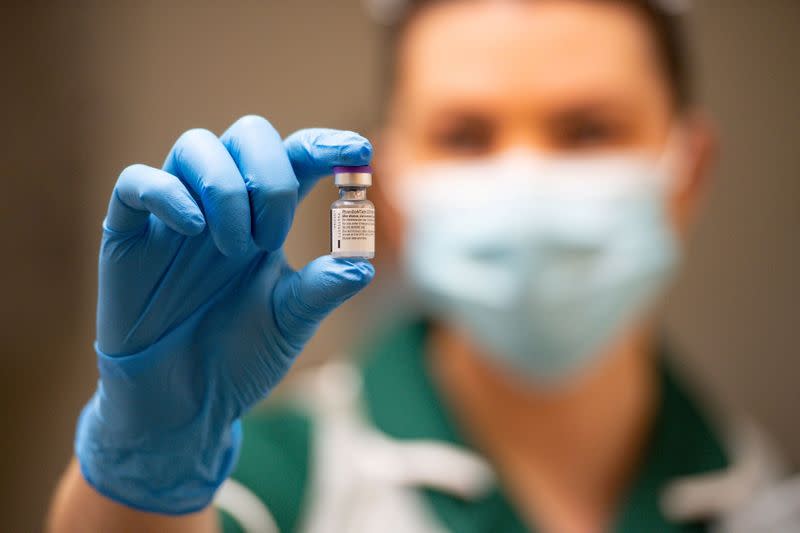 FILE PHOTO: A nurse holds a phial of the Pfizer/BioNTech COVID-19 vaccine at University Hospital in Coventry