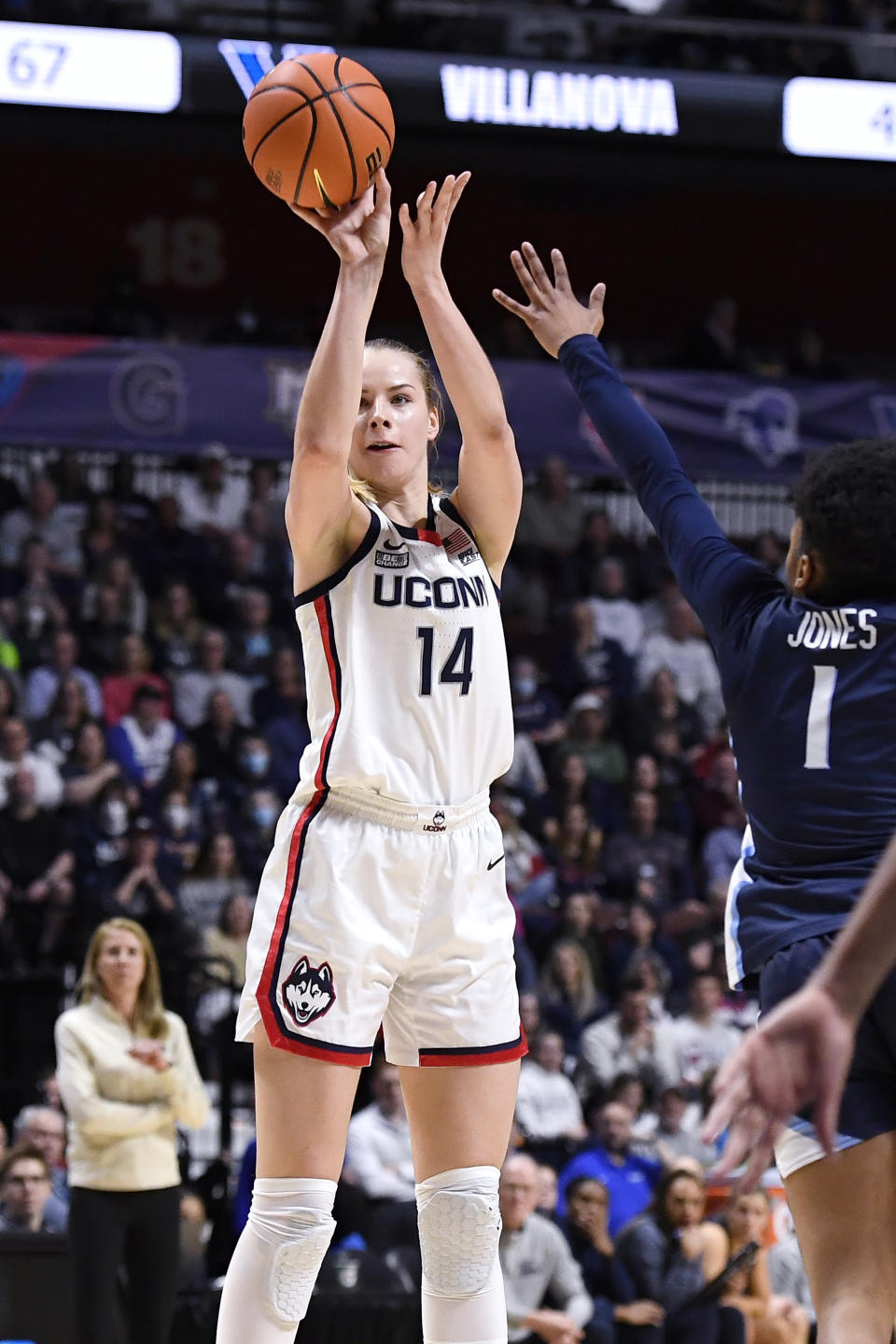 UConn's Dorka Juhasz (14) shoots over Villanova's Zanai Jones (1) during the second half of an NCAA college basketball game in the finals of the Big East Conference tournament at Mohegan Sun Arena, Monday, March 6, 2023, in Uncasville, Conn. (AP Photo/Jessica Hill)