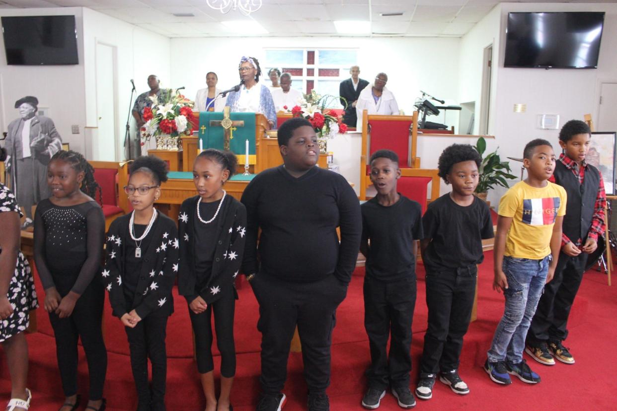 Students from Caring and Sharing Learning School sing “Lift Every Voice and Sing” during a Black history program Sunday at Mount Olive AME Church in southeast Gainesville.
(Credit: Photo by Voleer Thomas, Correspondent)