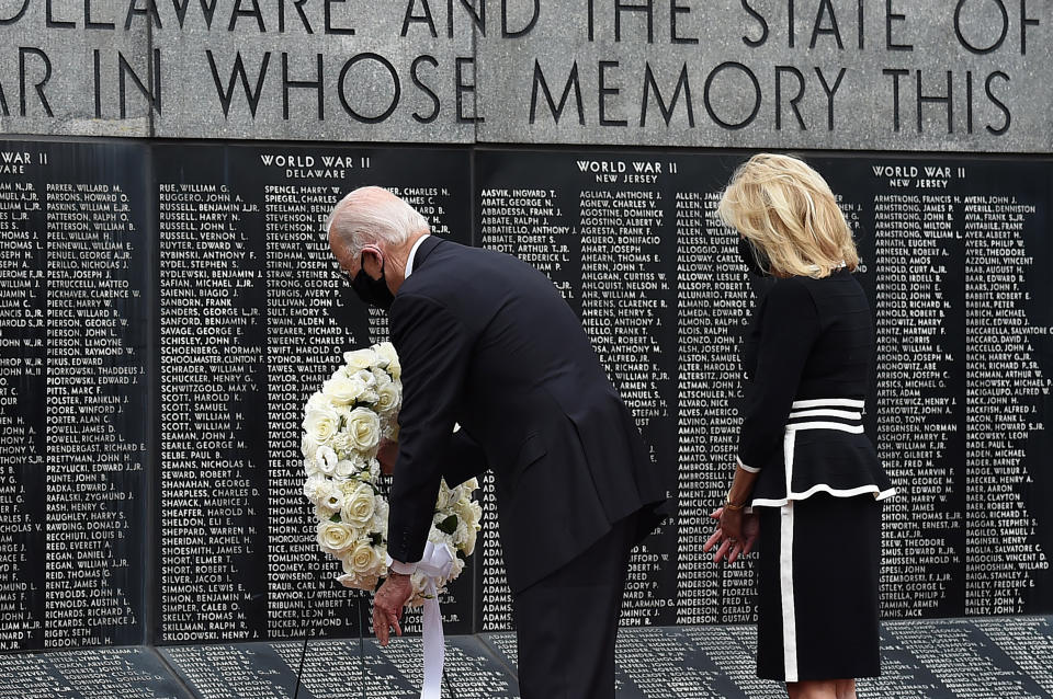 Democratic presidential candidate and former US Vice President Joe Biden with his wife Jill Biden, pay their respects to fallen service members on Memorial Day at Delaware Memorial Bridge Veteran's Memorial Park in Newcastle, Delaware, May 25, 2020. (Photo by Olivier DOULIERY / AFP) (Photo by OLIVIER DOULIERY/AFP via Getty Images)