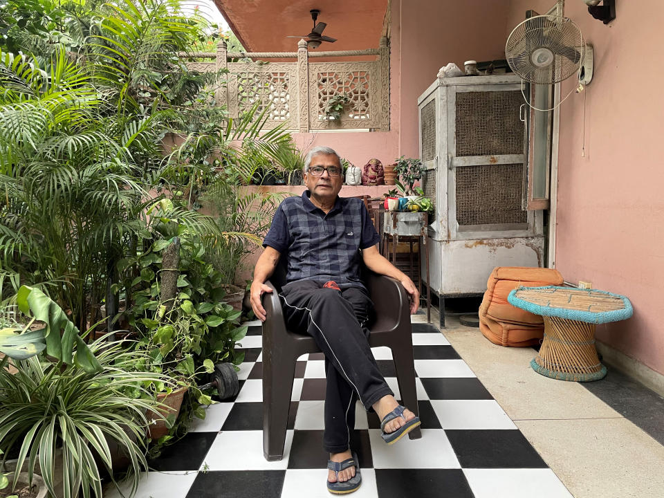 In this photo released by Chakravorty family, Prabir Chakravorty, 73, a COVID-19 survivor, sits in the garden area of his home in New Delhi, India on May 17, 2021. Chakravorty, the family patriarch and widower, a construction executive was treated at home for the coronavirus. (Chakravorty family via AP)
