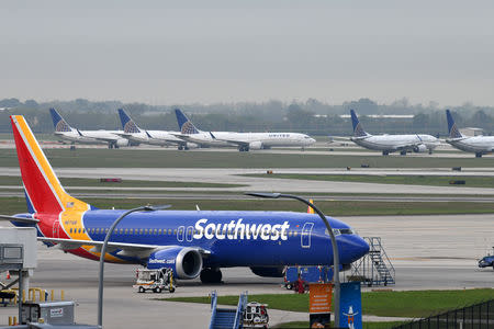 A Southwest Airlines Boeing 737 MAX 8 aircraft is pictured in front of United Airlines planes, including Boeing 737 MAX 9 models, at William P. Hobby Airport in Houston, Texas, U.S., March 18, 2019. REUTERS/Loren Elliott/File Photo