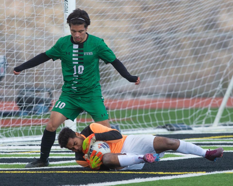 Victor Valley's Josiah Lopez loses possession by a close save from Roybal's goalie during the second half of Tuesday's playoff match. Victor Valley defeated Roybal 2-0 in the first round of the CIF State Southern California Regional Division 5 playoffs on Tuesday, Feb. 28, 2023.