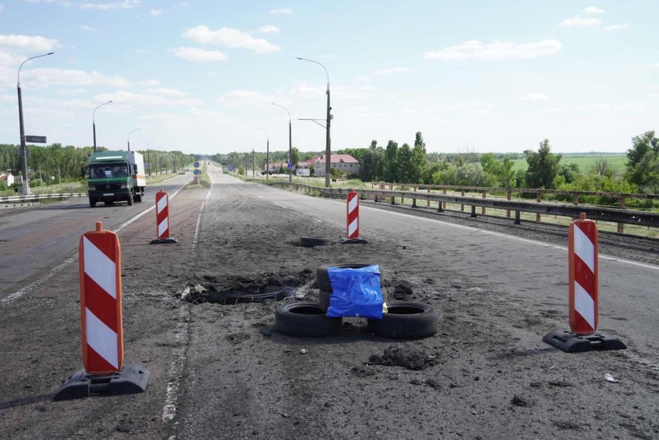 Craters on Kherson’s Antonovsky bridge caused by a Ukrainian rocket strike (AFP via Getty Images)