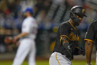 Pittsburgh Pirates' Rodolfo Castro passes New York Mets' Nick Tropeano, back left, as he runs the bases after hitting a home run during the seventh inning of a baseball game Friday, July 9, 2021, in New York. (AP Photo/Frank Franklin II)