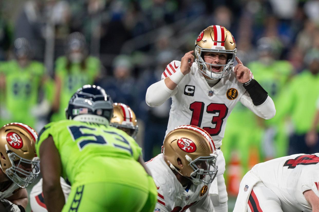 San Francisco 49ers quarterback Brock Purdy signals to his team during a Nov. 23 game against the Seattle Seahawks. The 49ers won 31-13.