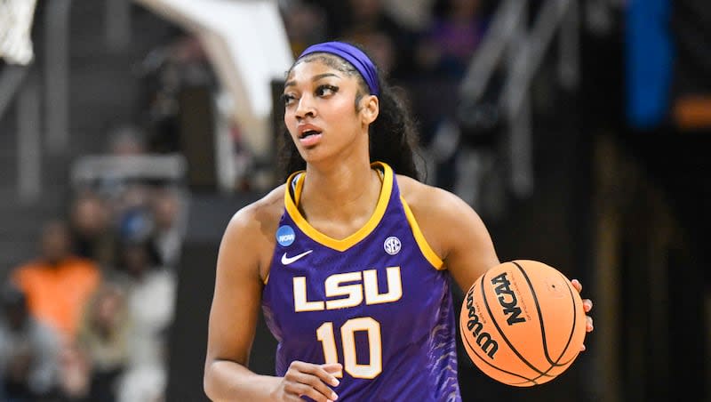 LSU forward Angel Reese (10) moves the ball against Iowa during a Elite Eight college basketball game in the NCAA Tournament, Monday, April 1, 2024, in Albany, N.Y.