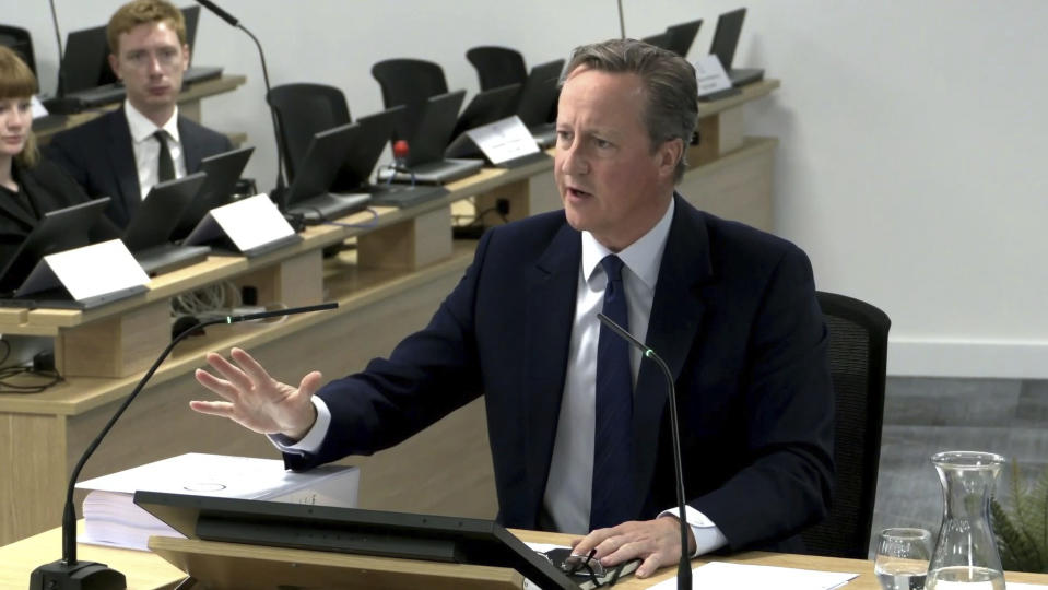 In this grab taken from video, Britain's former prime minister David Cameron gives evidence to the UK COVID-19 Inquiry, during its first investigation (Module 1) examining if the pandemic was properly planned for, at Dorland House in London, Monday June 19, 2023. (PA via AP)