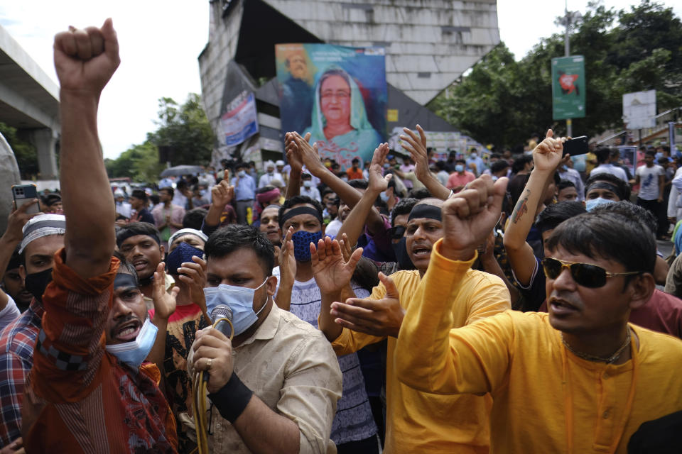 Hundreds of Hindus protesting against attacks on temples and the killing of two Hindu devotees in another district shout slogans in Dhaka, Bangladesh, Monday, Oct.18, 2021. A viral social media image perceived as insulting to the country's Muslim majority last week triggered protests and incidents of vandalism at Hindu temples across Bangladesh. About 9% of Bangladesh’s 160 million are Hindus. (AP Photo/Mahmud Hossain Opu)