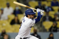 Los Angeles Dodgers' Chris Taylor drives in a run with a single during the fifth inning of a baseball game against the San Francisco Giants Friday, May 28, 2021, in Los Angeles. (AP Photo/Marcio Jose Sanchez)