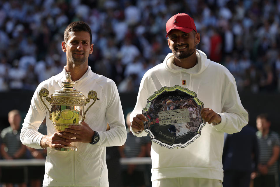 Pictured left to right, champion Novak Djokovic  and runner-up Nick Kyrgios with their silverware after the 2022 Wimbledon final. 