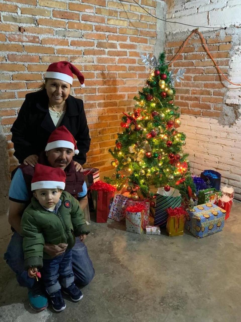 Roberto Padilla Arguelles with his wife and grandson.