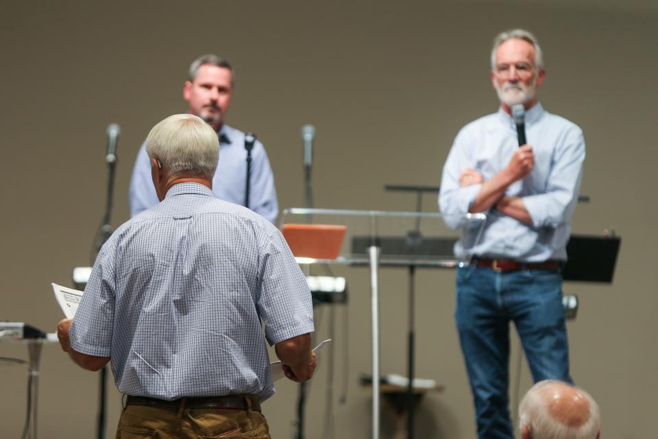 John Cochran, a representative from Indiana’s Economic Development Corp., and  Jack Wittman, vice president of eastern water for INTERA Inc., listen to residents explain their concerns about the company's initial testing of the aquifer in Lafayette, on Thursday, Sept. 28, 2023, at Church Alive, in Lafayette.
