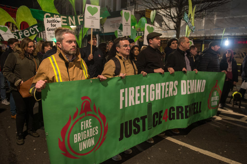 Survivors of the Grenfell fire are joined by fire fighters and supporters for a monthly silent walk to remember the dead and demand justice for the living (Guy Smallman/Getty Images)