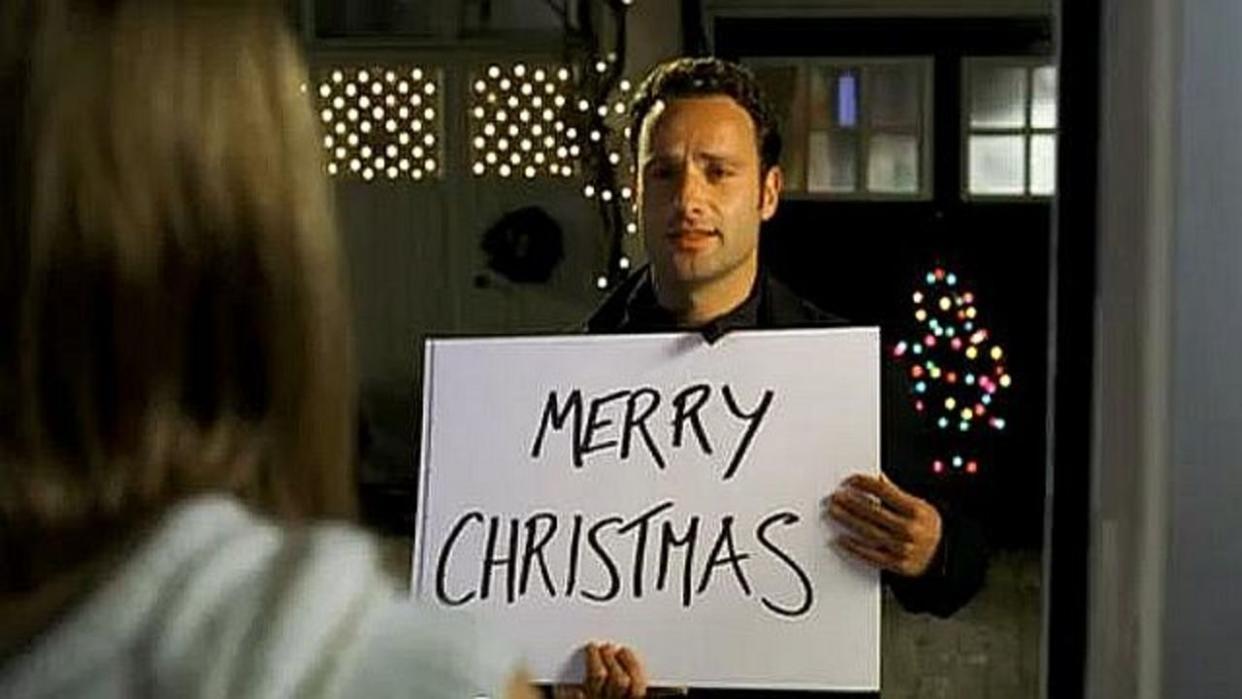  Mark (Andrew Lincoln) from Love Actually holding up Merry Christmas sign. 