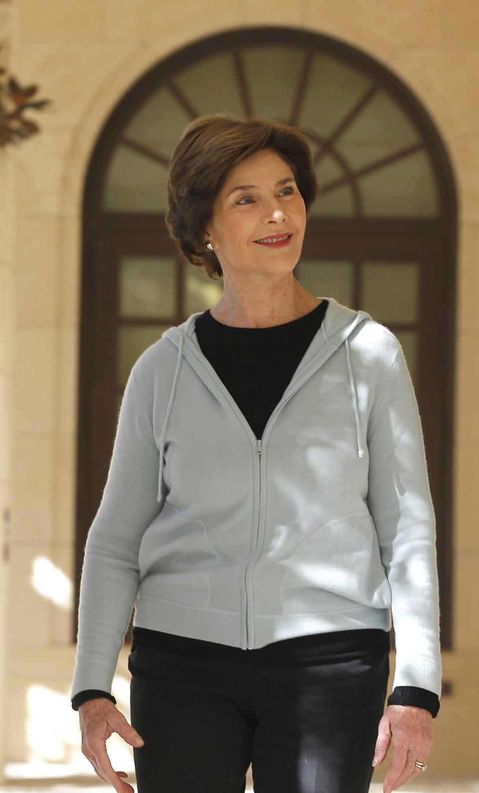 In this Monday, Oct. 29, 2012 photo, former first lady Laura Bush walks the Texas interpretation of the White House Rose Garden at the George W. Bush Presidential Center in Dallas. A 15-acre park at the upcoming George W. Bush Presidential Center will recreate a Texas prairie, complete with a wildflower meadow, a special blend of native grasses and even trees transplanted from the former president's ranch. The presidential center on the campus of Southern Methodist University will feature a library that will include the archives and a museum. (AP Photo/LM Otero)