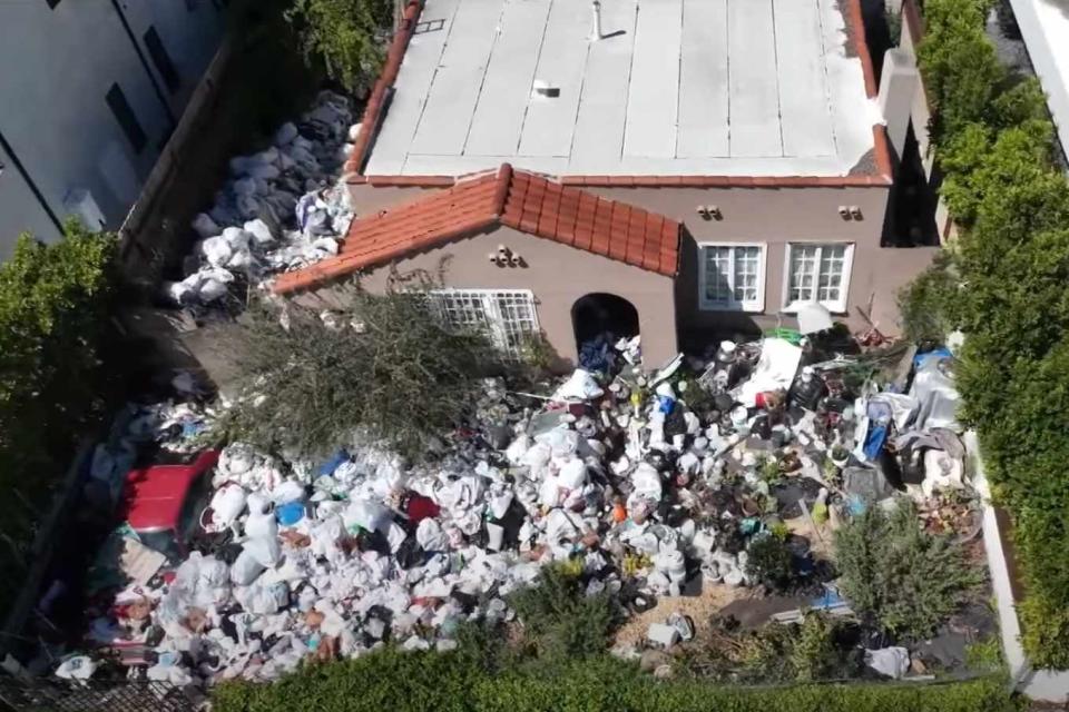 <p>KTLA 5/YouTube</p> California home surrounded by trash