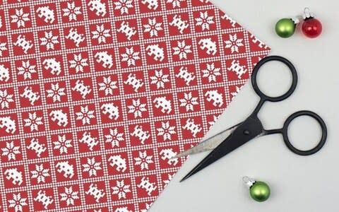 Robot Paper Jam Space Invaders Christmas Wrapping Paper - Credit: Etsy