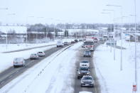 <p>Traffic is reduced to one lane in the snow on the M9 in Co. Kildare. Around 4,000 gritters are taking on the freezing weather and drivers are being urged to ask themselves if their journeys are ‘really necessary’. (PA) </p>